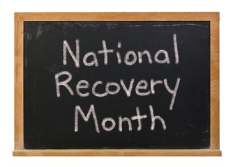 Obraz premium National Recovery Month written in white chalk on a black chalkboard isolated on white