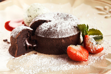 Chocolate fondant with vanilla ice cream and strawberry