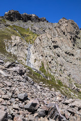 The mountain does not stop the water that start to melt from the snow and flows along it slopes making amazing waterfalls inside the central Andes Valleys at Santiago de Chile