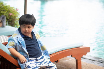 boy waiting to play in swimming pool