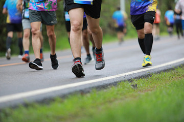 Group of people running race marathon