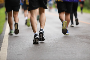 Group of people running race marathon