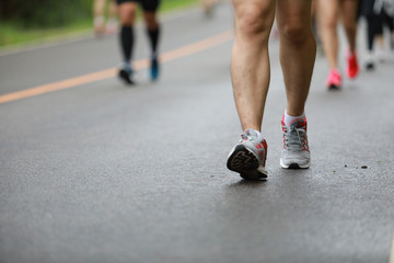 Group of people running race marathon