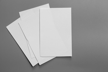 Blank portrait A4. brochure magazine isolated on gray, changeable background / white paper isolated on gray