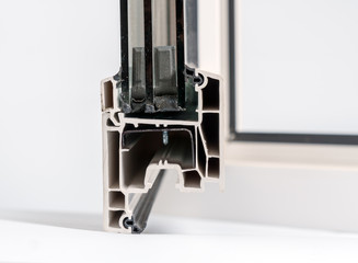 Plastic window profile. Windows section with triple glazing