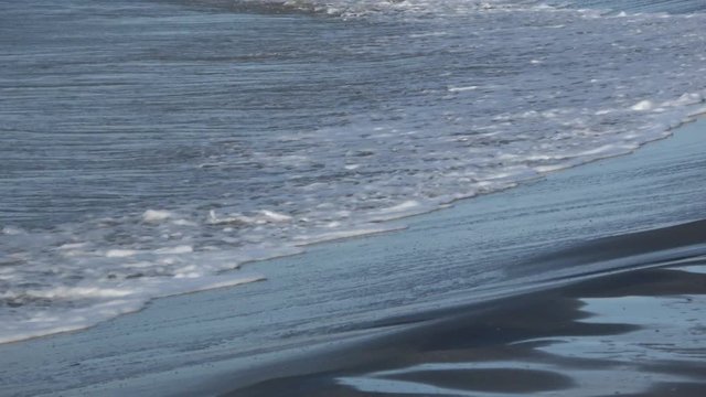 Waves rolling on the beach is a stormy day, winter mediterranean sea. Focene, Lazio, Italy. 4k