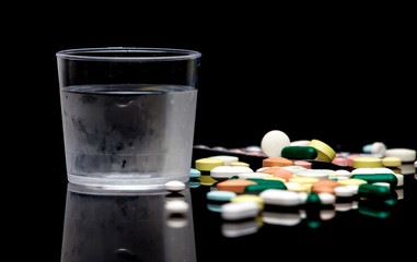 Pills against black background