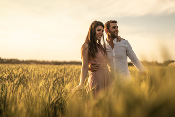 Romantic Couple on a Love Moment at gold wheat field - Holambra, Sao Paulo, Brazil