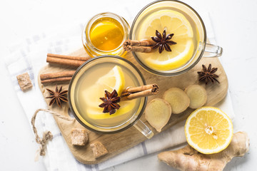 Obraz na płótnie Canvas Hot Ginger tea with lemon, honey and spices.
