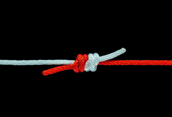 Tie the knot with red and white rope on black background, with clipping path