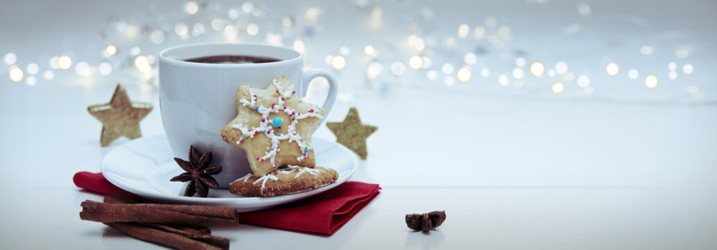 Christmas Cookie with garland and coffee cup.
