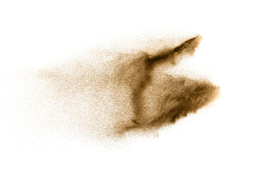 Dry river sand explosion. Golden colored sand splash agianst white background.