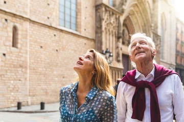 Foto op Canvas Senior couple of tourists visiting the old town in Barcelona © william87