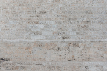 Gray brick stone wall in Spain. Stone texture. Stones with different shapes