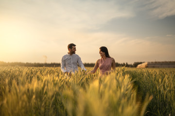 Romantic Couple on a Love Moment at gold wheat flied - Holambra, Sao Paulo, Brazil