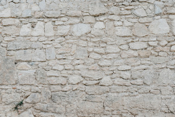 Gray stone wall. Stone texture. Stones with different shapes