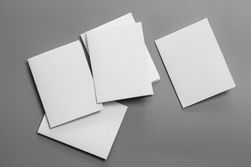 Blank portrait mock-up paper. brochure magazine isolated on gray, changeable background / white paper isolated on gray