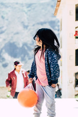 Little girl with a ball in her hands