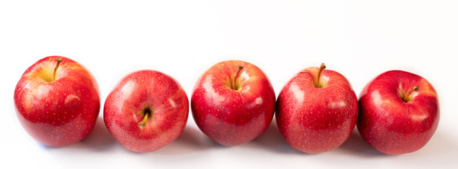 red ripe apples on a white background