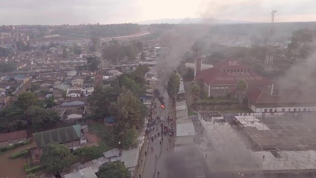 Aerial over rioting, fires and riots in the Kibera slum of Nairobi during controversial elections in Kenya in 2018.