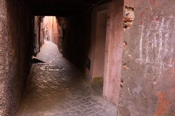 old empty alley in historic medina in marrakesh, morocco