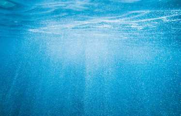 Blue underwater with little bubbles in mediterranean sea on Sardegna island, Italy