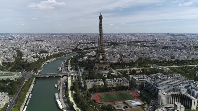 Aerial footage of the Eiffel Tower is a wrought iron lattice structure on Champ de Mars in Paris France the building is named after the engineer whose company designed and built it 4k quality