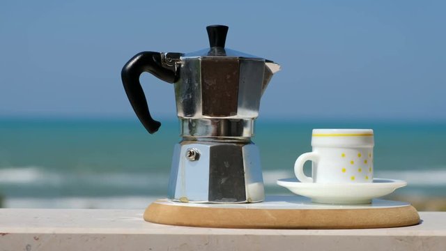 moka pot coffee maker sea background italian breakfast