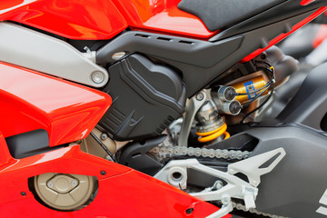 Detail of a modern red motorcycle with large displacement