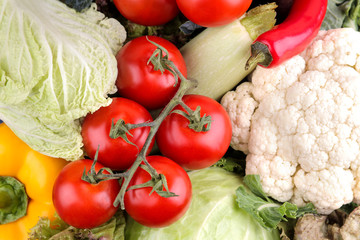 Fresh vegetables including lettuce cucumber cabbage onion pepper beetroot carrot zucchini and tomatoes. Vegetable background. close-up