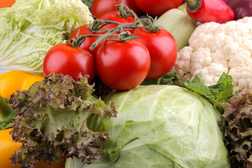 Fresh vegetables including lettuce cucumber cabbage onion pepper beetroot carrot zucchini and tomatoes. Vegetable background. close-up
