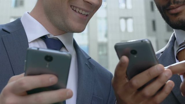 Colleagues using smartphones at coffee break, social network for business people