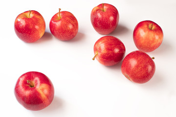 Red ripe apples on a white background. Harvest red apples.