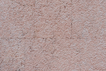 Pink grungy old stone texture in Spain