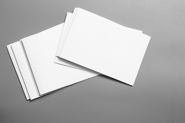 Blank portrait mock-up paper. brochure magazine isolated on gray, changeable background / white paper isolated on gray