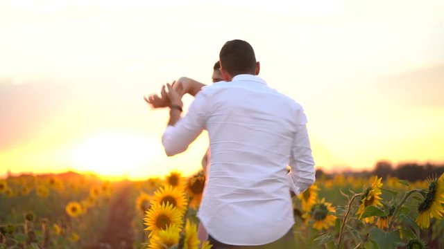 Romantic Couple Dancing in a Sunflower field