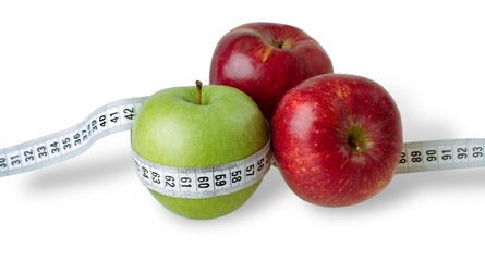 Apples with a measuring tape - weight loss concept