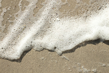 Marine foam on the sand.