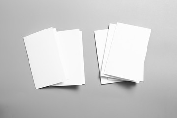 Blank portrait mock-up paper. brochure magazine isolated on gray, changeable background / white paper isolated on gray