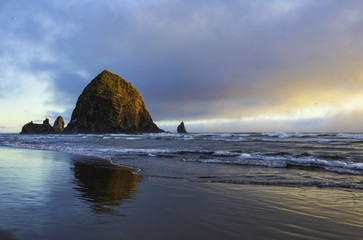 Closeup of Haystack Rock in the golden light of sunset
