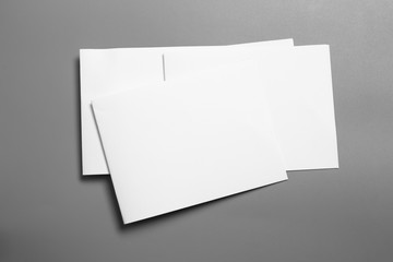 Blank portrait mock-up paper. brochure magazine isolated on gray, changeable background / white paper isolated on gray