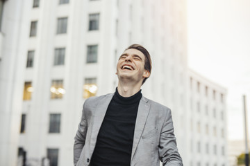 Close up of happy man smiling while going to or from work.