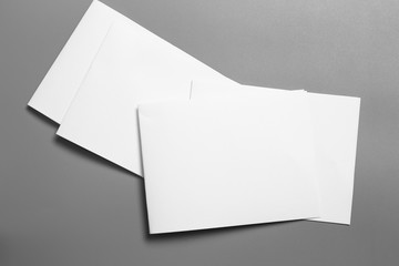 Blank portrait mock-up paper. brochure magazine isolated on gray, changeable background / white paper isolated on gray