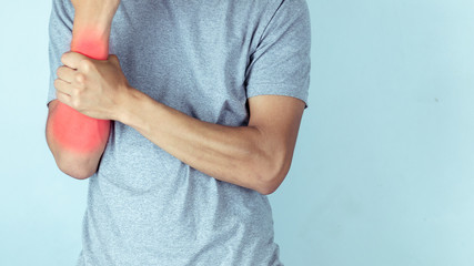 Closeup on man with arm pain.