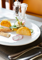 Healthy breakfast food. Delicious benedict for real gourmet. Beautifully served benedict on white tray in restaurant.