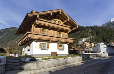 Fototapeta na wymiar Houses built in the traditional Tyrolean style. Mayrhofen, Austria.