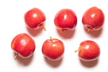 red ripe apples on a white background