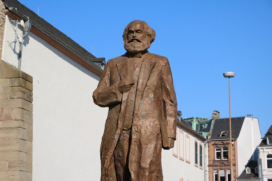 Karl Marx statue monument on the Simeonstiftplatz in Trier, Germany