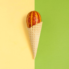 Mini melon with striped skin like watermelon in waffle cone