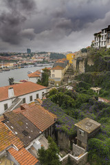Fototapeta na wymiar Roofs of old houses next to the river Douro, Porto, Portugal